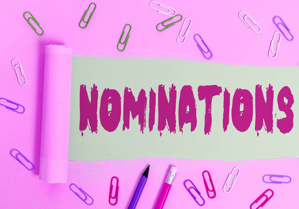 Writing note showing Nominations. Business photo showcasing the act of officially suggesting someone for a job or position. - Photo, Image