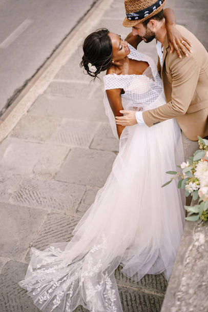 Wedding in Florence, Italy. Multiethnic wedding couple. African-American bride and Caucasian groom - Photo, Image