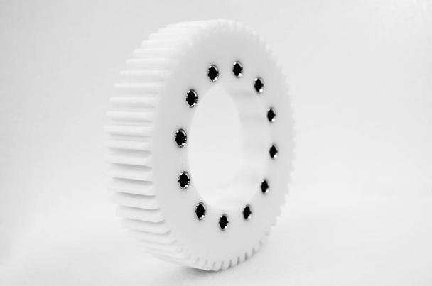 Piñón plástico engranaje blanco rueda piezas producto fotografía
 - Foto, imagen