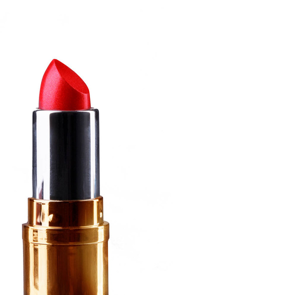 Red lipstick in a gold case. Cosmetics for lips. Makeup. - Photo, Image