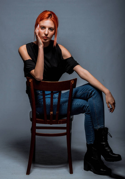 Portrait of a beautiful female model posing in trendy black top - Foto, imagen