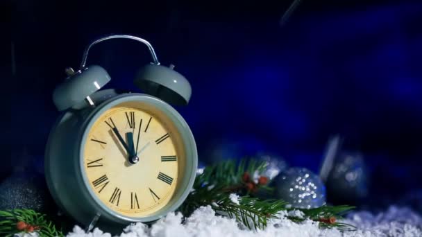 Alarm clock with falling snow on dark color background - Footage, Video