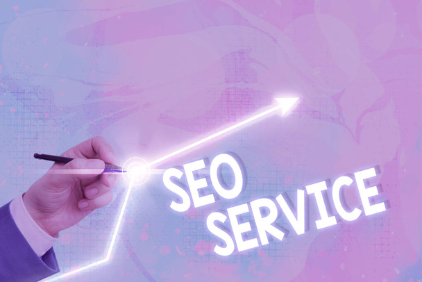 Znak tekstowy pokazujący Seo Service. Koncepcyjne techniki i procedury fotograficzne w celu zwiększenia widoczności strony internetowej. - Zdjęcie, obraz