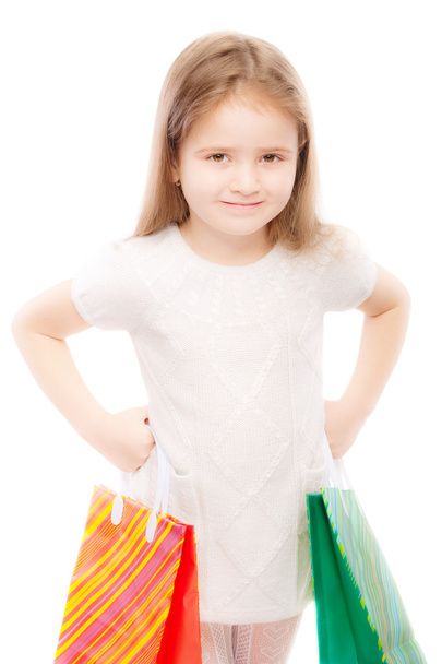 Portrait of beautiful preschool child with packages - Фото, изображение