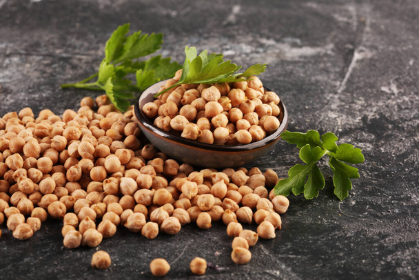 Raw Chickpeas in a bowl. Chickpeas is nutritious food. Healthy and natural vegetarian food - Photo, Image