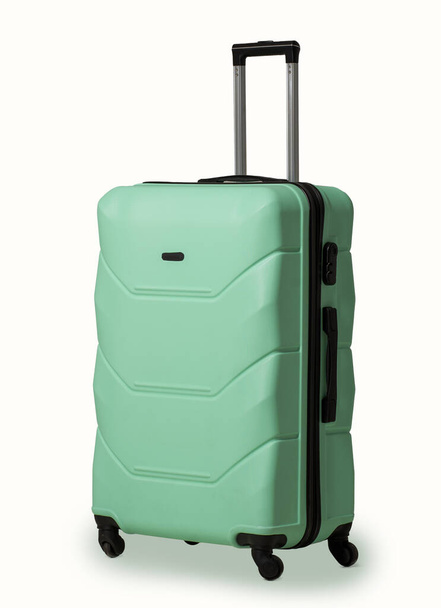 Plastic suitcase with wheels. - 写真・画像