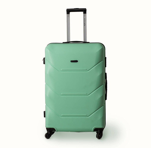 Plastic suitcase with wheels. - Foto, Imagen
