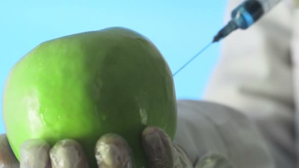 Scientist Injecting Apple with Chemical Solution for Experiment. Corona. Covid-19 - Footage, Video