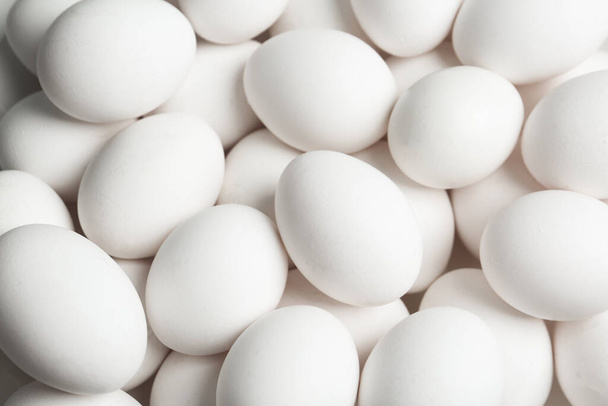 Fresh raw white chicken eggs as background, above view - Zdjęcie, obraz