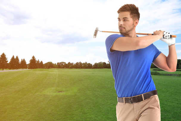 Young man playing golf on course with green grass. Space for design - Foto, imagen