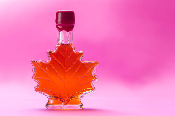 Canadian maple syrup in maple leaf shaped glass bottle - Photo, image