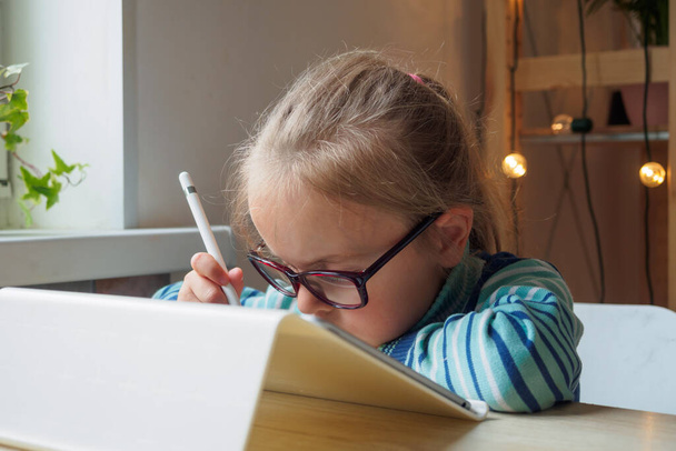 Little girl with tablet and stylus learning drawing online - Photo, Image