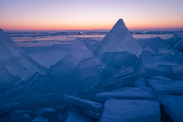 Baikal frozen lake in winter season in a morning sunrise at Uzury bay, Siberia in Russia, Asia - Фото, изображение