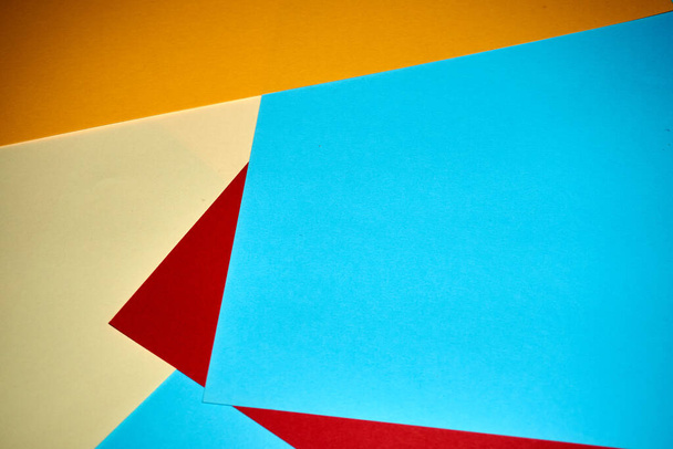 Colorful geometric texture paper pattern in yellow, blue, red. - Photo, Image