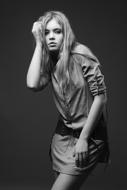 Seductive fashion portrait of young woman on dark background - Fotó, kép
