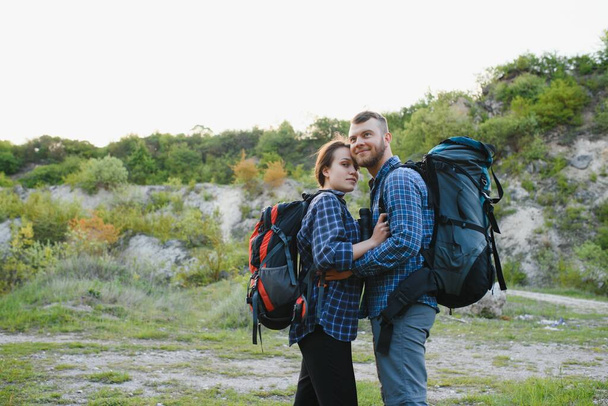 happy young couple hiking in mountain - Φωτογραφία, εικόνα