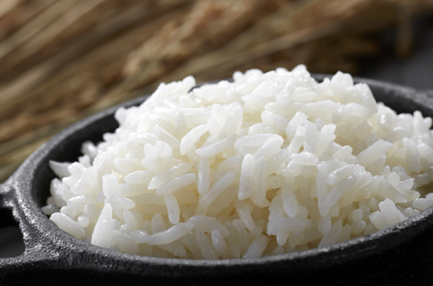 Closeup rice in black wok - Photo, Image