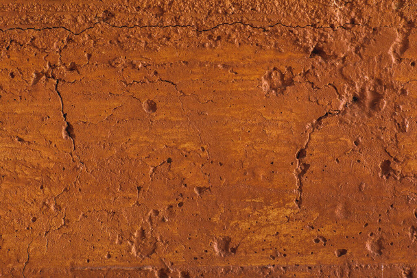 Perinteinen marokkolainen terrakotta värillinen tausta. Oranssi tai okra savi seinä rakenne. Maalattu nuhjuinen betoni
. - Valokuva, kuva