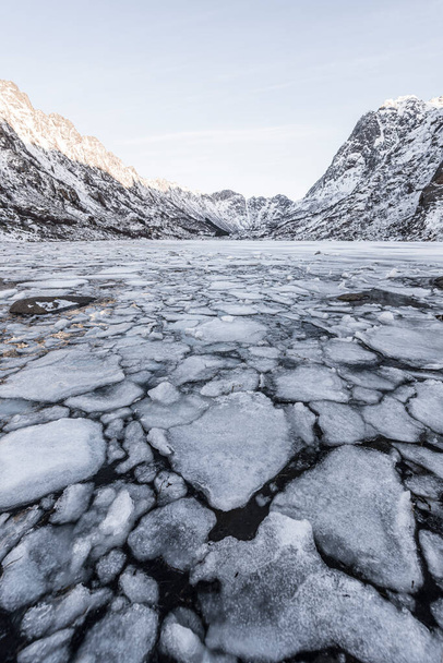 Winter landscape on a lake during Lofoten islands winter. Snow and ice melting  - Photo, Image
