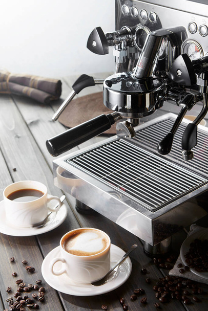Two cups of coffee on the coffee machine, closeup - Photo, Image