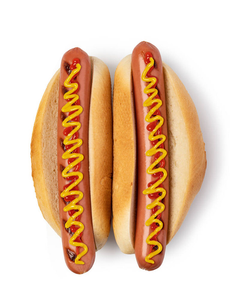 Hot dog met ketchup en mosterd geïsoleerd op witte achtergrond. - Foto, afbeelding