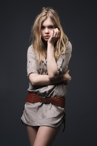 Fashion portrait of seductive blond girl on dark background - Photo, Image