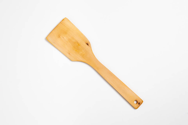 Wooden Spatula isolated on white background. Wooden turner for cooking.High-resolution photo.Top view. - Photo, Image