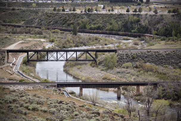 Flowing river with two train bridges - Photo, Image