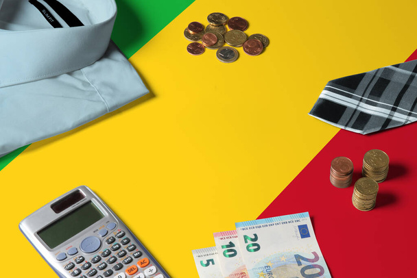 Mali flag on minimal money concept table. Coins and financial objects on flag surface. National economy theme. - Fotografie, Obrázek