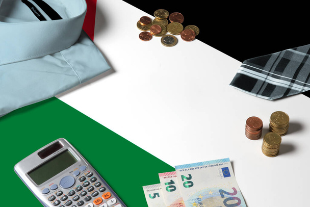 Palestine flag on minimal money concept table. Coins and financial objects on flag surface. National economy theme. - Fotografie, Obrázek