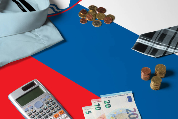Slovenia flag on minimal money concept table. Coins and financial objects on flag surface. National economy theme. - Fotografie, Obrázek