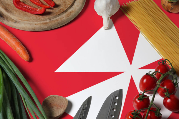 Wallis And Futuna flag on fresh vegetables and knife concept wooden table. Cooking concept with preparing background theme. - Photo, Image