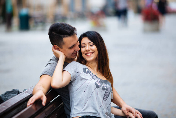 young couple posing on city background, travel concept - 写真・画像