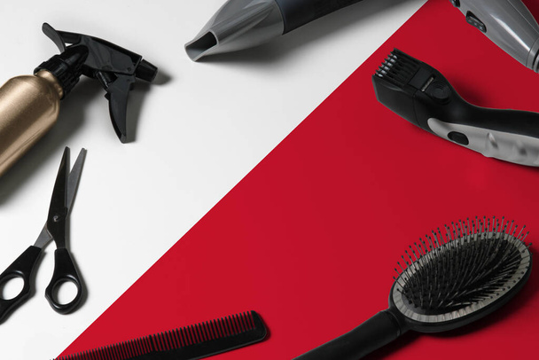 Malta flag with hair cutting tools. Combs, scissors and hairdressing tools in a beauty salon desktop on a national wooden background. - Photo, Image
