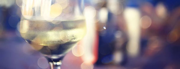 evening in a restaurant, blurred abstract background, bokeh, alcohol concept, wine glasses in a bar - Photo, image