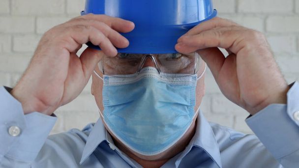 Confident Image with an Engineer Wearing Face Protection Mask Against Viruses. - Photo, Image