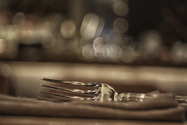 abstract background, restaurant concept blurred background evening food fork, knife, cutlery, table setting - Photo, Image