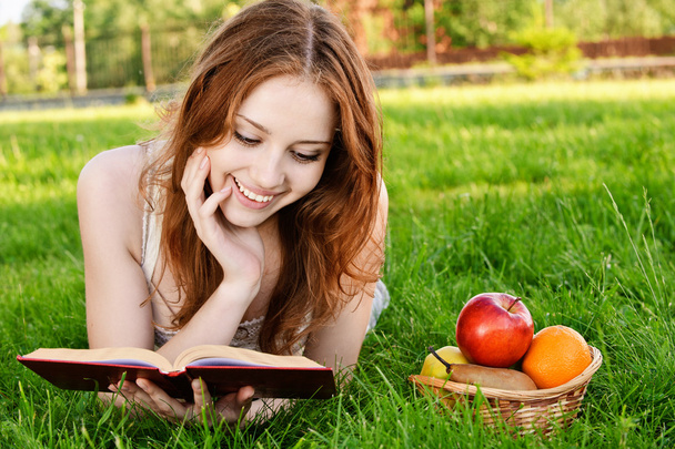Girl with book and apples - Photo, Image