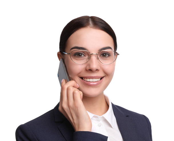 Young businesswoman talking on mobile phone against white background - Zdjęcie, obraz