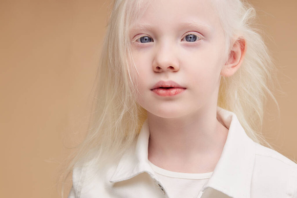 awesome albino kid with blonde hair, isolated - Фото, изображение