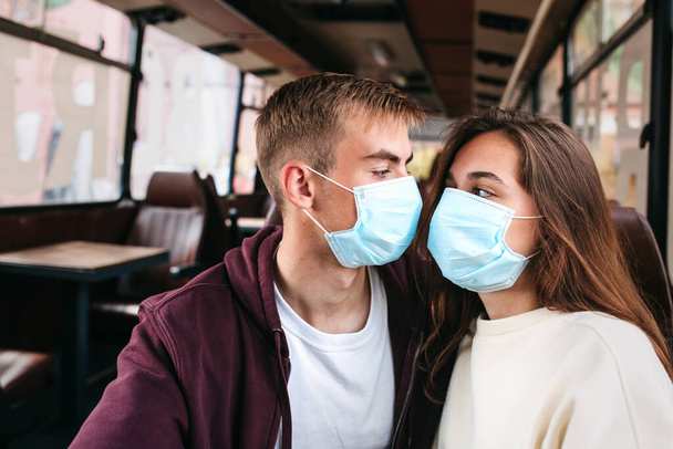 COVID-19 Pandemic Coronavirus Couple home isolation auto quarantine wearing face mask protective for spreading of disease virus - Zdjęcie, obraz