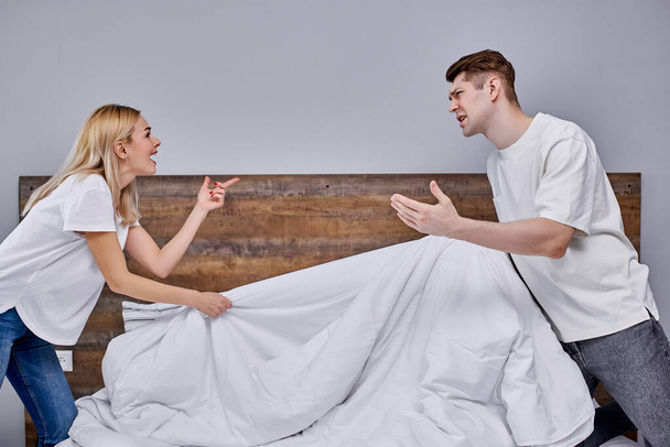 lovely young couple have emotional quarrel at home in the morning - Foto, Imagem