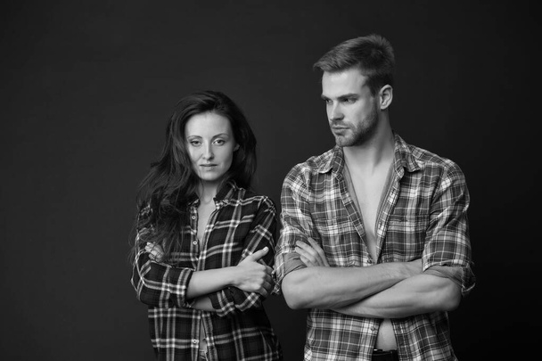 Country style. Woman and man wear checkered shirt. Rustic and country. Sexy people. Youth fashion. Fashionable outfit. Simple casual clothes. Couple feeling comfortable. Country music concept - Foto, Bild
