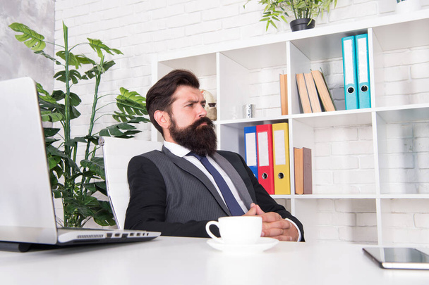 Giving the man confidence. Business man sit at work desk. Bearded man wear fashion suit. Unshaven man with beard and mustache hair. Formal office wear. Fashion and style - Photo, Image
