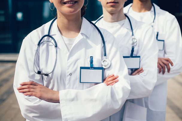 close up. a group of young doctors standing in a row. - Foto, afbeelding