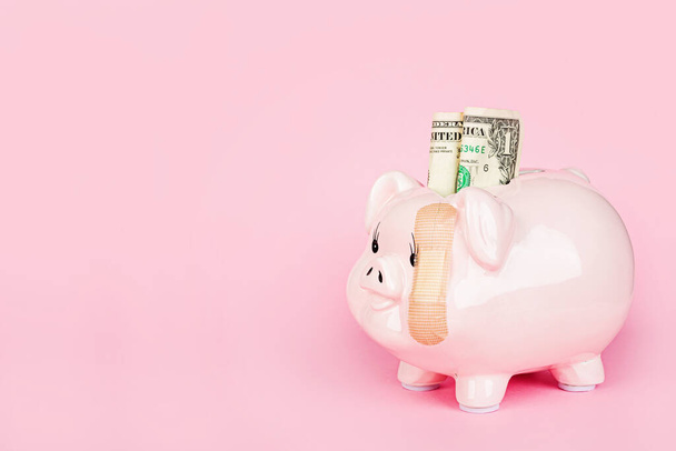 Broken Piggy bank on pink background. mockup, template. Concept of financial crisis after coronavirus covid-19 pandemic. - Фото, изображение
