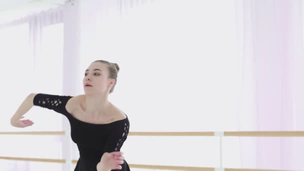 Young ballerina makes beautiful movements with her hands. - Imágenes, Vídeo