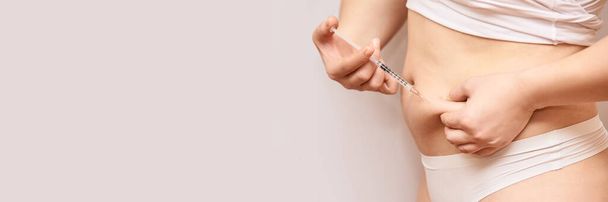 Person injecting stomach medicine treatment. Diabet or hormone injection. - Photo, image