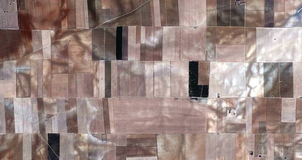 The fields are dressed in Autumn, tribute to Picasso, abstract photography of the Spain fields from the air, aerial view, representation of human labor camps, abstract expressionism, abstract naturalism, - Photo, Image