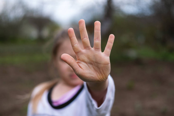 Girl making stop gesture with hand - Valokuva, kuva